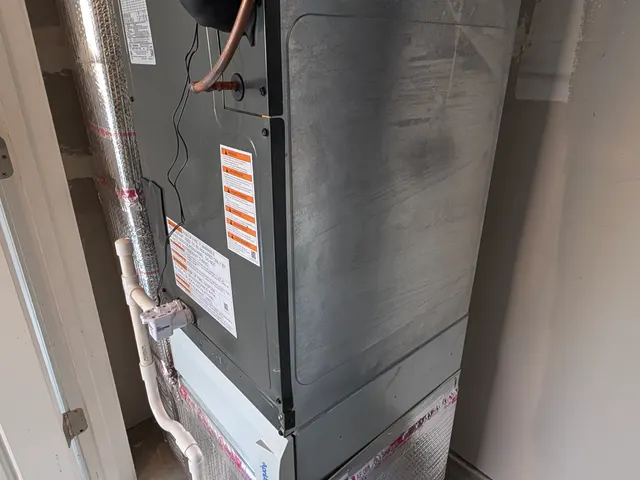Insulated coil plenum and PVC condensate drain lines at a newly installed air handler in Clark County Indiana