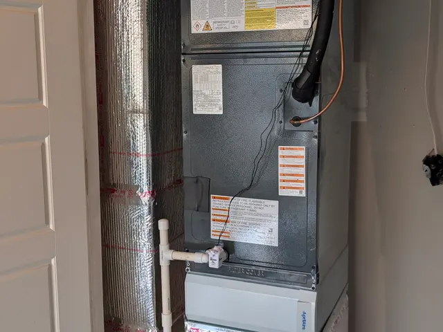 Completed air handler and evaporator coil install with insulated flex duct in a Clark County Indiana garage closet