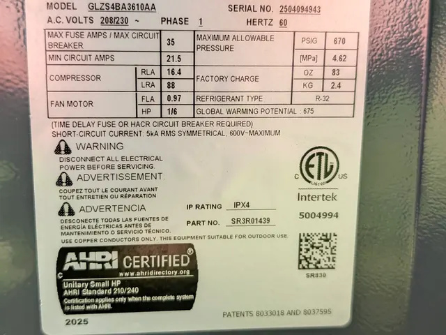 Daikin GLZS4BA3610AA heat pump data plate listing the R-32 refrigerant charge and model details