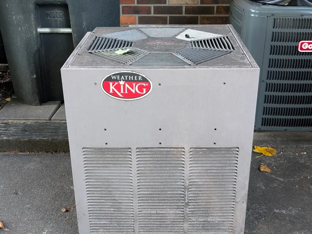 Old Weather King central AC condenser before removal at Jeffersonville Indiana home repair job