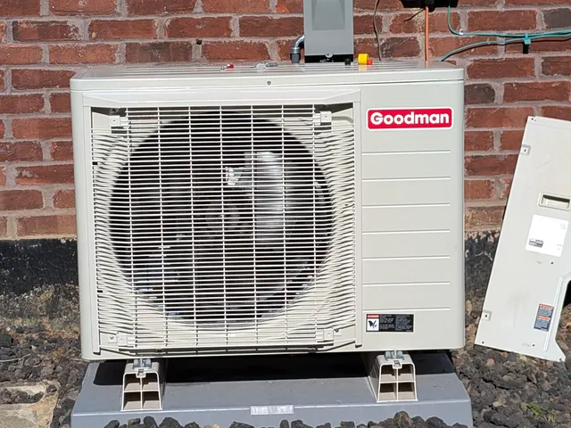 Installed Goodman mini-split heat pump outdoor unit on mounting pad Memphis Indiana