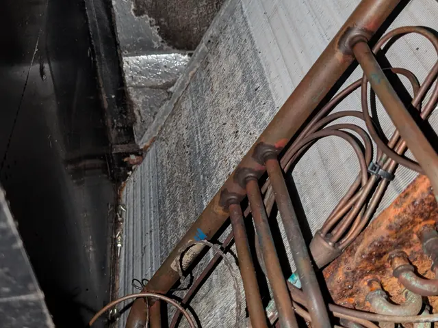 Severely corroded copper refrigerant lines and coil inside failed air handler Memphis Indiana