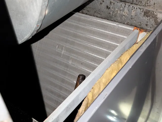 Blower housing, evaporator coil and rust-stained drain pan inside the old air handler, Memphis Indiana second opinion inspection