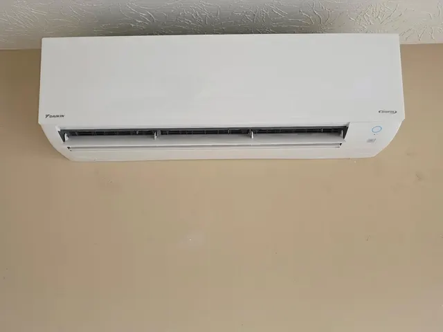 Daikin inverter mini-split indoor wall unit installed high on a wall in a southern Indiana home