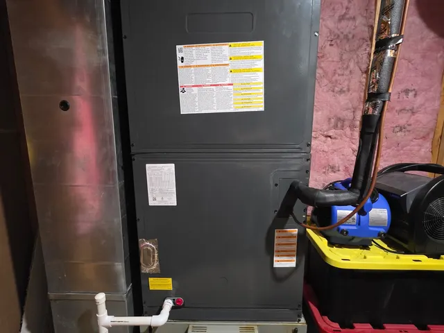 Existing air handler unit in basement utility space during HVAC second opinion inspection