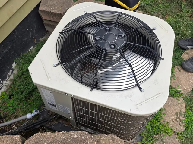 Top-down view of older central air condenser fan during HVAC second opinion inspection visit